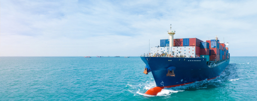 Container ship loaded with cargo sailing across open water