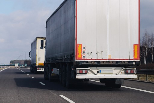 Semi trucks hauling freight along a highway